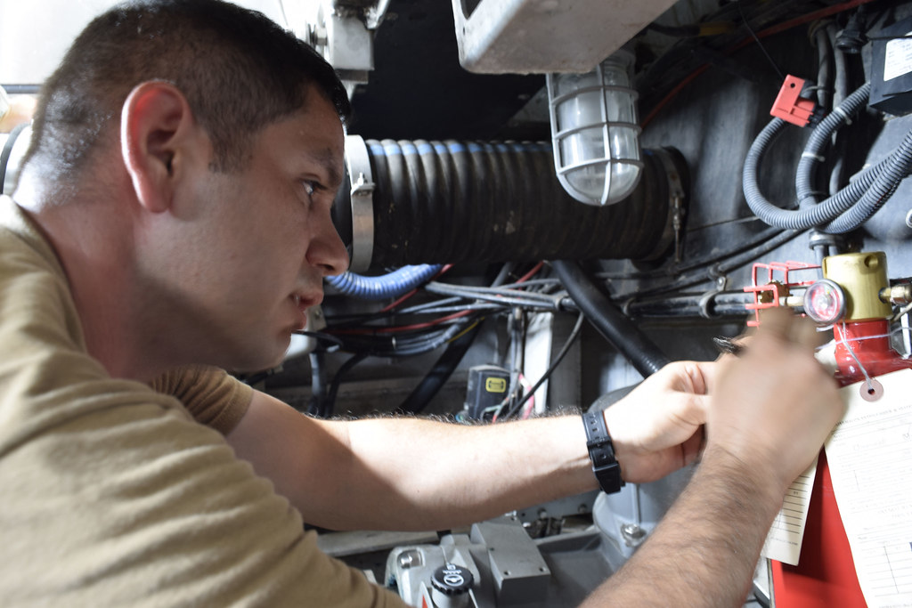 Technician checking and tagging a fire suppression unit